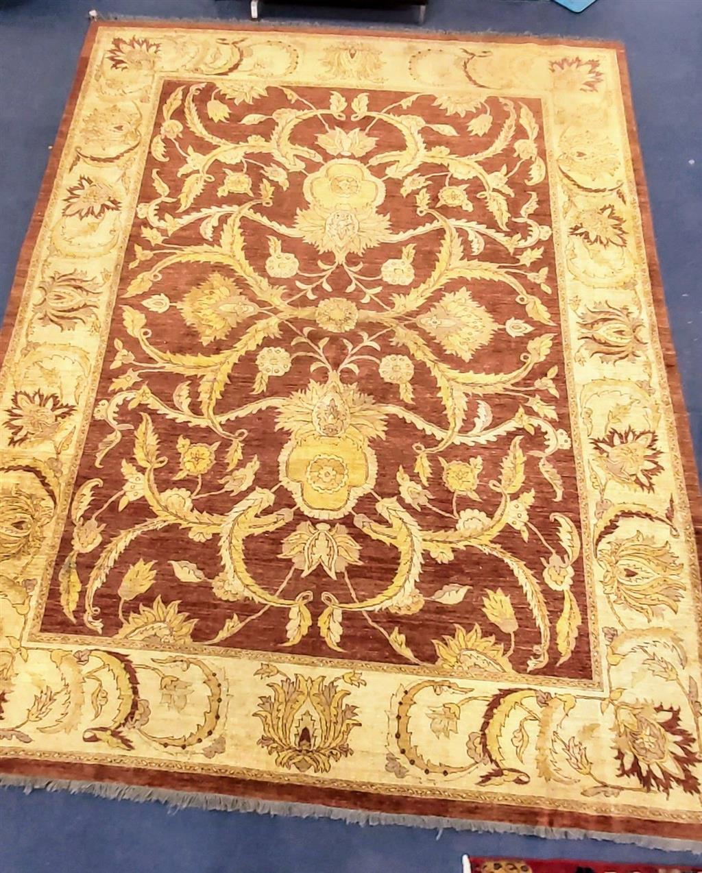 A Zeigler style burgundy ground carpet, 400 x 300cm